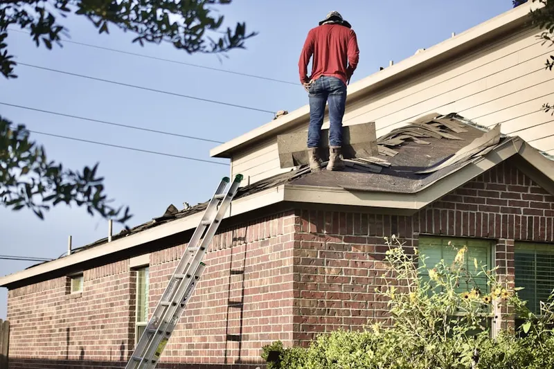 Professional roofer working on a residential roof in Bowie Mill Estates